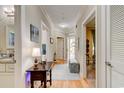 Hallway with hardwood floors, neutral walls, and views into other rooms at 128 Puffin Dr. # 1E, Pawleys Island, SC 29585