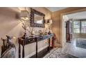 Foyer featuring a decorative mirror, lamps, console table, and stylish decor, with hardwood-style flooring at 141 N Gate Rd., Myrtle Beach, SC 29572
