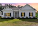 Charming single-story home with white siding, black shutters, and a well-manicured lawn at 1500 Sunmeadow Dr., Conway, SC 29526