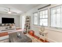 Comfortable living room featuring hardwood floors, natural light, ceiling fan, and modern decor at 218 Busbee St., Conway, SC 29526