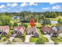 Picturesque aerial view of a home next to a golf course and pond in a tranquil neighborhood at 2617 Willet Cove, Conway, SC 29526