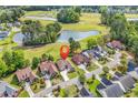 Scenic aerial shot featuring a home near a golf course, a pond, and lush greenery at 2617 Willet Cove, Conway, SC 29526