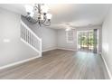 Bright living room with wood flooring and a sliding glass door at 309 Seabert Rd. # 309, Myrtle Beach, SC 29579