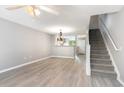 Spacious living area with staircase, ceiling fan, and wood flooring at 309 Seabert Rd. # 309, Myrtle Beach, SC 29579