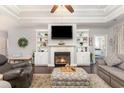 Comfortable living room with a fireplace, built-in shelves, and dark hardwood flooring at 349 N Bar Ct., Myrtle Beach, SC 29579