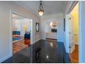 Welcoming foyer features gleaming tile floors and doorways into adjacent living spaces at 4546 River Rd., Little River, SC 29566