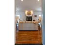 Inviting living room showcasing a fireplace and hardwood floors at 4546 River Rd., Little River, SC 29566