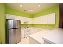 Bright kitchen with white cabinets, modern appliances, and a sleek stainless steel refrigerator at 4660 Lightkeepers Way # 37B, Little River, SC 29566