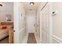 Inviting hallway with tile floor, neutral paint, and access to bedroom and closet at 4709 Wild Iris Dr. # 101, Myrtle Beach, SC 29577
