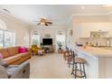 Open living space with modern furnishings, ceiling fan, and breakfast bar at 4709 Wild Iris Dr. # 101, Myrtle Beach, SC 29577
