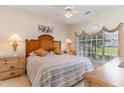 Comfortable bedroom with natural light and a decorative window at 4729 Wild Iris Dr. # 104, Myrtle Beach, SC 29577