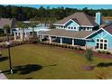 Community clubhouse featuring a pergola, a pool and a well manicured lawn at 4834 Hopespring St., Myrtle Beach, SC 29579
