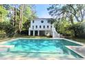 Back exterior featuring a beautiful pool, outdoor space, and the back of the home at 486 Lantana Circle, Georgetown, SC 29440
