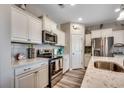 Well-equipped kitchen featuring white cabinets, stainless steel appliances, and granite countertops at 5077 Gladstone Dr, Conway, SC 29526
