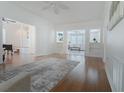 Bright, open-concept living room featuring hardwood floors, neutral walls, and plenty of natural light from adjoining rooms at 618 6Th Ave. N, Surfside Beach, SC 29575