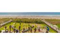 Overhead view of grassy backyard with a playground, perfect for families at 6804 N Ocean Blvd. # 427, Myrtle Beach, SC 29572
