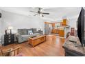 Open-concept living space featuring hardwood floors, and a seamless flow to the kitchen at 706 Birch Ln., Conway, SC 29526