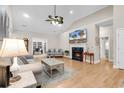 Bright living room features a fireplace, hardwood floors, and neutral color palette at 756 Lalton Dr., Conway, SC 29526