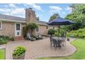 Inviting backyard patio with outdoor seating and a lush, landscaped area at 7607 Kingswood Dr., Myrtle Beach, SC 29572