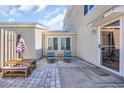 Cozy outdoor patio seating area with brick pavers and plenty of room to relax at 800 9Th Ave. S # A-4, North Myrtle Beach, SC 29582