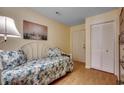 Cozy bedroom features a decorative bed, closet, and access to the outside at 813 S Ocean Blvd. # 301, Surfside Beach, SC 29575