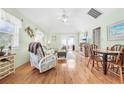 Open-concept living area boasting a ceiling fan, hardwood floors, and plenty of natural light at 820 9Th Ave. S, North Myrtle Beach, SC 29582