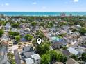 Aerial view of a residential community near the ocean, highlighting the neighborhood layout and proximity to the beach at 829 9Th Ave. S, North Myrtle Beach, SC 29582