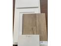 Selection of interior finish materials, including white cabinets and luxury vinyl flooring at 962 Oak Hollow St., Longs, SC 29568