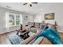 Comfortable living room with a large window, vaulted ceiling, and stylish furnishings at 122 Desurrency Ct., Georgetown, SC 29440