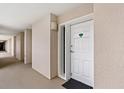 Condo entrance featuring a unit number 506 and neutral-colored walls with a modern light fixture at 1401 S Ocean Blvd. # 506, North Myrtle Beach, SC 29582