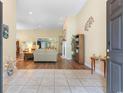 Bright living room with tile entry, hardwood floors, and an open floor plan at 142 Pinfeather Trail, Myrtle Beach, SC 29588