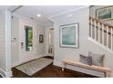 Bright entryway featuring hardwood floors, a bench, and artwork, creating an inviting atmosphere with natural light at 1804 Tryon Dr, Myrtle Beach, SC 29588
