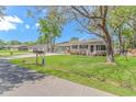 Charming home with well-maintained lawn and flower bushes, nestled on a tree-lined street at 1931 Jasper St., Georgetown, SC 29440