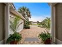 View from front door to lush landscaping and brick driveway at 216 Northside Dr., Little River, SC 29566
