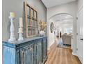 Inviting hallway features hardwood floors and an arched doorway leading to the living area at 240 Hillsborough Dr., Conway, SC 29526