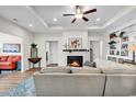 Cozy living room with a fireplace, built-in shelves, and a comfortable sofa at 240 Hillsborough Dr., Conway, SC 29526