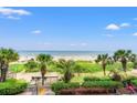 Amazing beach view from condo featuring palm trees, walkway to the sand, and ocean views at 2401 S Ocean Blvd. S # 267, Myrtle Beach, SC 29577