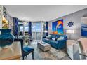 Coastal condo with a stylish living room with ocean views from the balcony, blue accents, and comfortable seating at 2504 N Ocean Blvd. # 934, Myrtle Beach, SC 29577