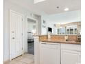 Galley kitchen with granite countertops, white appliances, and modern finishes at 2506 North Ocean Blvd. # 534, Myrtle Beach, SC 29577