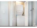 Laundry closet with stacked washer and dryer with folding doors at 2506 North Ocean Blvd. # 534, Myrtle Beach, SC 29577
