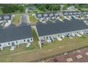 Back aerial view of townhomes with a fence, patios and outdoor furniture at 291 Brackish Dr. # 291, Myrtle Beach, SC 29588