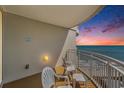 Ocean view balcony with seating and sunrise colors at 300 N Ocean Blvd. # 1732, North Myrtle Beach, SC 29582