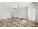 Spacious bedroom featuring hardwood floors, ceiling fan, and ample natural light at 3332 Little Bay Dr., Conway, SC 29526
