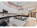 Spacious kitchen with white cabinetry, granite countertops, and stainless steel appliances for modern convenience at 4084 Hagwood Circle, Conway, SC 29526