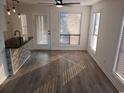 Sunlit dining area with wood-look flooring and large windows, perfect for entertaining guests at 418 C Tree Top Ct. # 0, Myrtle Beach, SC 29588