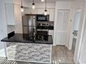 Charming kitchen featuring stainless appliances, granite counters and updated cabinetry at 418 C Tree Top Ct. # 0, Myrtle Beach, SC 29588