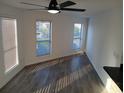 Bright living area with ample natural light, features sleek flooring and a modern ceiling fan at 418 C Tree Top Ct. # 0, Myrtle Beach, SC 29588