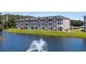 Exterior of a condo with a pond view and lots of green space at 4503 W Harbour Ct. # S9, Little River, SC 29566