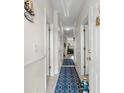 Welcoming hallway with nautical decor and blue rugs leading to the living area at 4503 W Harbour Ct. # S9, Little River, SC 29566