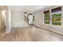 Bright living room featuring hardwood floors and large windows at 505 Forestbrook Dr., Myrtle Beach, SC 29579
